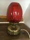 Victorian oil lamp with cranberry glass, converted to electric