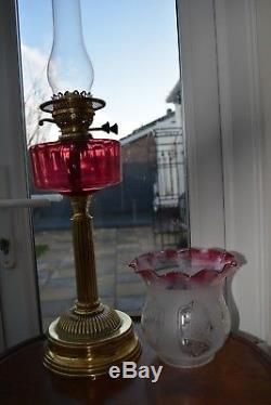 Victorian twin burner oil lamp. Cranberry font no cracks