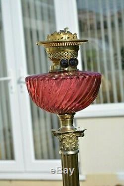 Victorian twin burner oil lamp. Pretty pink cranberry font no damage